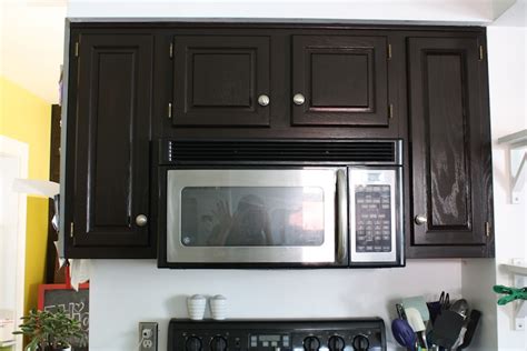 Ballard says you should refinish the cabinets already in your kitchen if the current design is functional. How to refinish oak cabinets with stain (the big reveal ...