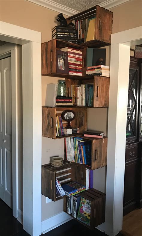 See more ideas about diy furniture, crate bookcase, wood diy. Bookshelves Stain unfinished wooden crates and hang on ...
