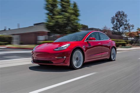 We've seen black, white and blue out in the wild, but never before have we seen red. Tesla Introduces Cheaper Model 3 | Automobile Magazine