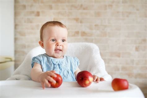 Baby Eating Fruit Little Girl Biting Yellow Apple Sitting In White