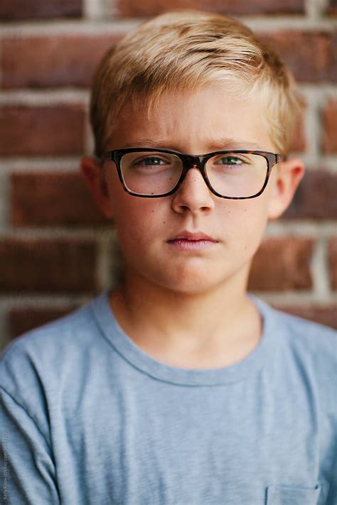 Portrait Of A Serious Blonde Boy Wearing Glasses By Kelly Knox