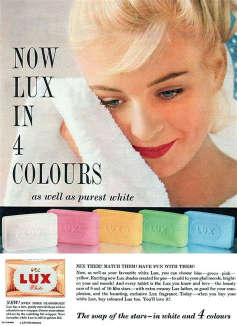 An Advertisement For Lux Soaps With A Woman Holding Her Face