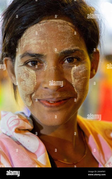 Portrait Of Local Woman With Thanaka On Her Face In Yangon Myanmar