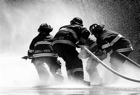 Royalty Free Photo Grayscale Photo Of Firefighter Holding Fire Hose