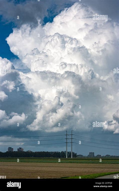 Huge Towering Cumulonimbus Storm Cloud Over The Dutch Landscape Stock