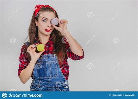 Beautiful Happy Cute Young Pretty Woman Holding Two Macaroons Hiding Her Eye Behind Blue One