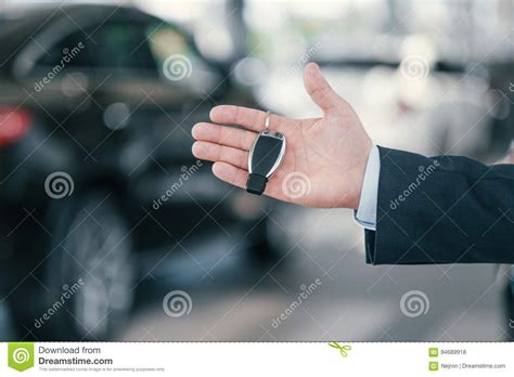 Giving a Key from New Car at Dealership Showroom Stock Photo - Image of