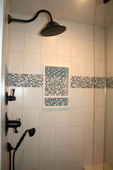 After you see accent wall designs, you'll want one in every single room of your house. Glass tile mosaic shower niche and accent border | Shower ...