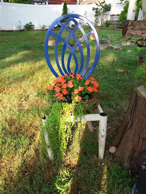 Measure your planter and find out if its size corresponds the size of the chair seat. Metal chair planter | Chair planter, Metal chairs, Planters