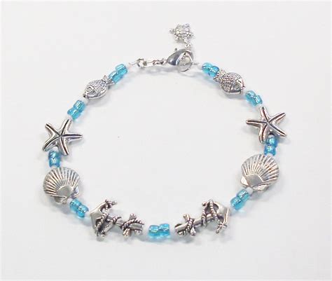 Handmade Aqua Blue Nautical Bracelet With Silver Charms