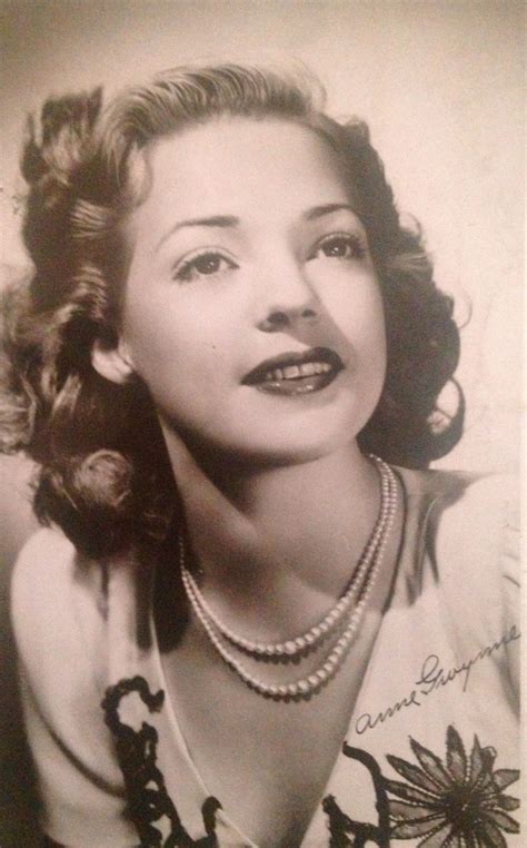 An Old Black And White Photo Of A Woman With Pearls On Her Necklace