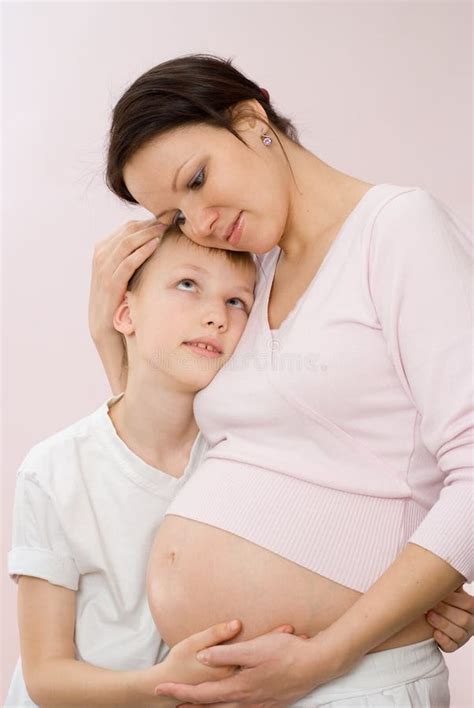 Pregnant Mother Tenderly Embracing Her Son Stock Photo Image Of
