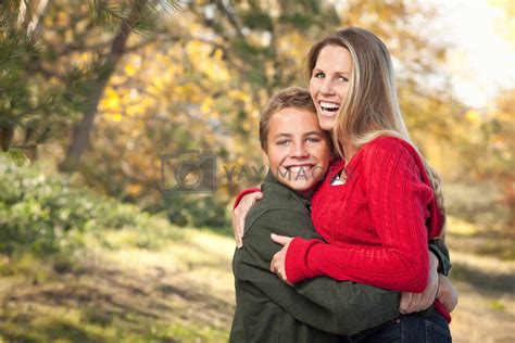 Royalty Free Image Playful Mother And Son Pose For A Portrait Outdoors By Feverpitched