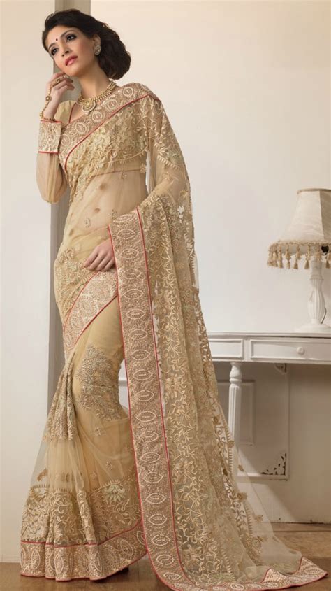 20 stunning golden designer sarees with matching blouse neck designs