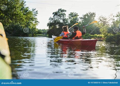 Beautiful Young Couple Kayaking On Lake Stock Photo Image Of Canoe