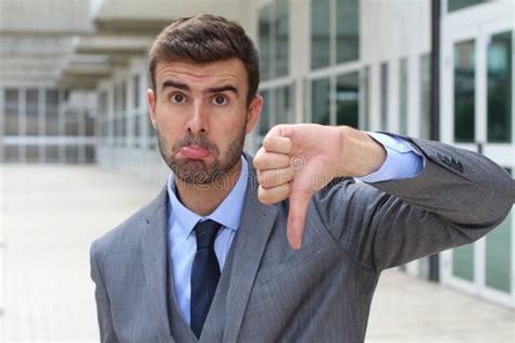 Sad Businessman Showing A Thumbs Down Stock Photo Image Of