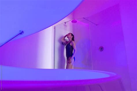 Relaxed Woman Showering Before Sensory Deprivation Float Experience