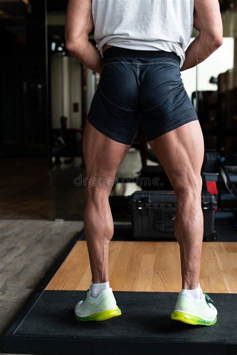 Man In Gym Showing His Well Trained Legs Close Up Stock Photo Image