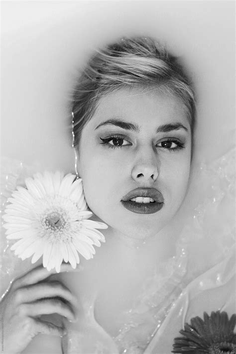Ver An Attractive Young Woman Lies In Milk Bath Del Colaborador De Stocksy Jovana Rikalo
