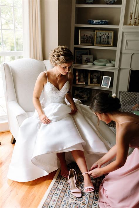 Bride Getting Dressed On Her Wedding Day Sweet Moment With Sister