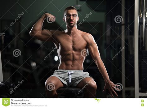 Nerd Man Sitting Strong In Gym Stock Photo Image Of Model Glasses