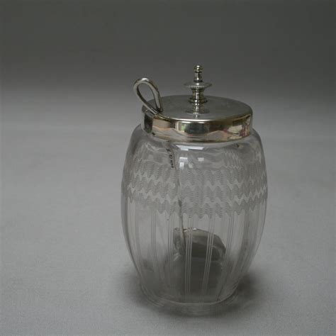 A Silver Plate Topped Glass Jam Jar With Silver Spoon Williams Antiques