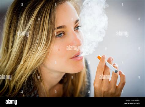 Woman Smoking Electronic Cigarette Stock Photo Alamy
