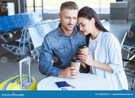 Adult Couple With Coffee To Go Hugging Stock Photo Image Of
