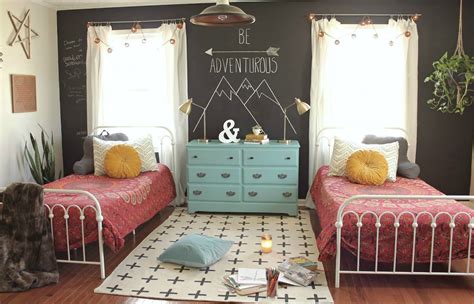 This girl's bedroom features a floral accent wall and touches of pink. 30 Vintage Kids Rooms That Stand the Test of Time
