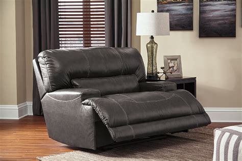 Swivel and reclining chairs are the best pieces of furniture where you can enjoy watching movies, read a book or just a corner to spend a little quality time. McCaskill Oversized Recliner | Ashley Furniture HomeStore