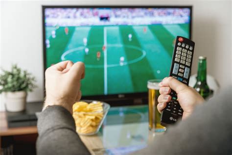 Hd Wallpaper Watching Football Match On Tv With Remote Controller