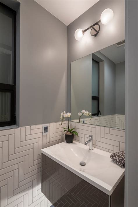 Our fave bathroom tile design ideas. White Bathroom Tiles in Herringbone by Noz Design ...