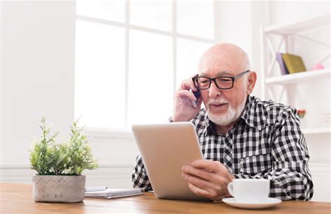 There are many tablets in the market today that have abilities to provide excellent experience to the seniors. Senior Man Talking On Phone With Tablet Stock Photo ...