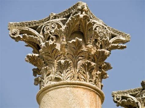 The Top Of An Ornately Decorated Column