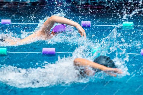 Premium Photo Young Boy Swimmers Racing In Freestyle