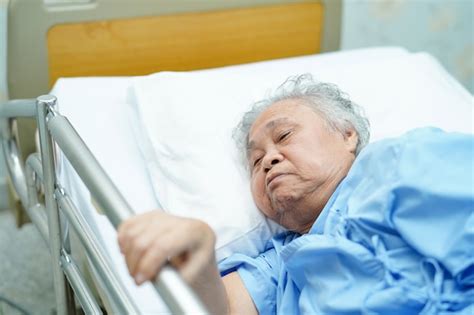 Premium Photo Asian Senior Or Elderly Old Woman Patient Lie Down Handle The Rail Bed With Hope
