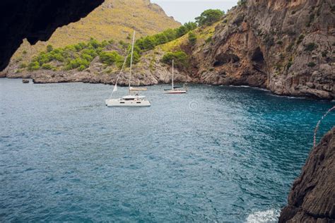 Aerial View Of Two Sailing Boats Anchoring Next To Reef Bird Eye View