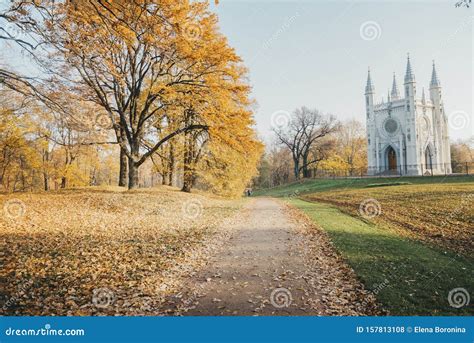 Catholic Chapel In The Park In The Autumn Trees With Golden Leaves