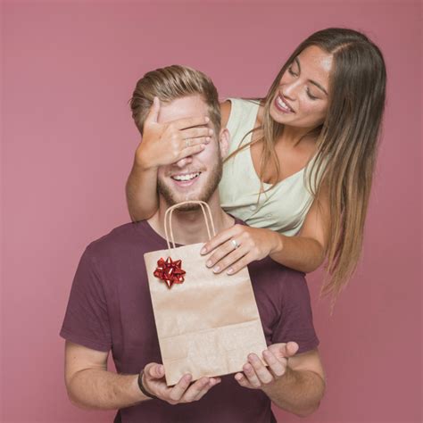 And, put the clothes you wore before into a bag. his eyes got wide, realizing i wasn't letting him change out of the cute capris and top outfit. Smiling woman covering her boyfriend's eye giving him gift ...