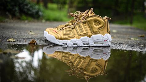 Supreme Unpaired Gold And White Nike Shoe Near Trees 4k Hd Wallpapers