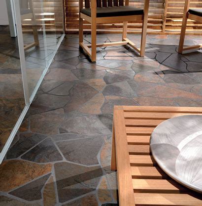 Natural stone is porous and to help prevent it from staining and water damage, this type of kitchen flooring needs to be regularly treated with a sealing agent. Stepping Stone Kitchen Floor - Rustic - New York - by Fiorano Tile Showrooms
