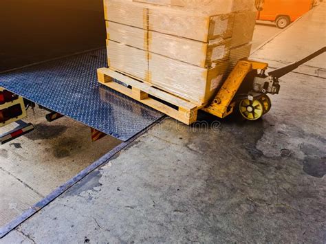 Worker Driving Forklift Loading And Unloading Shipment Carton Boxes And