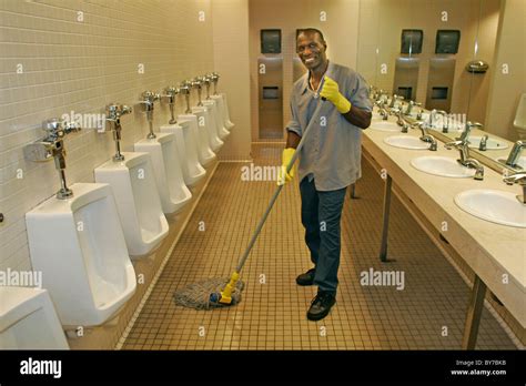 Janitor Cleaning Mens Room Stock Photo 33968911 Alamy