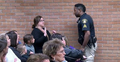 teacher is arrested during school board meeting for questioning superintendent