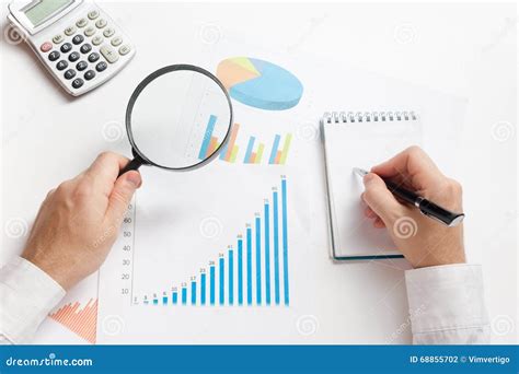 Businessman Counting Losses And Profit Working With Statistics