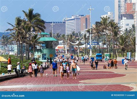 People Walking On Early Morning Beachfront Paved Promenade Editorial