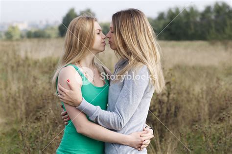 Two Sisters Or Female Friends In A Close Embrace Royalty Free Stock
