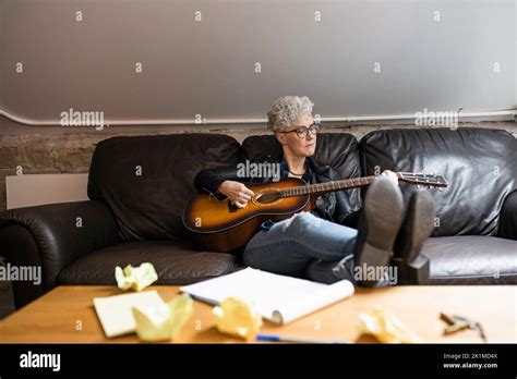 Mature Woman Playing Guitar Stock Photo Alamy