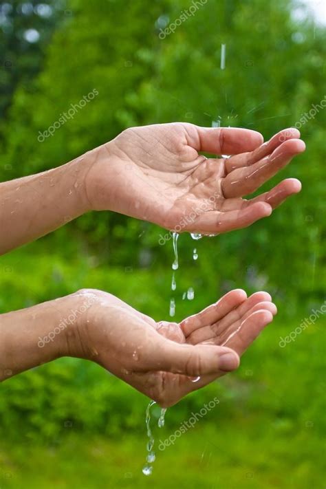 Hands Catching Raindrops — Stock Photo © Rodimovpavel 76316721