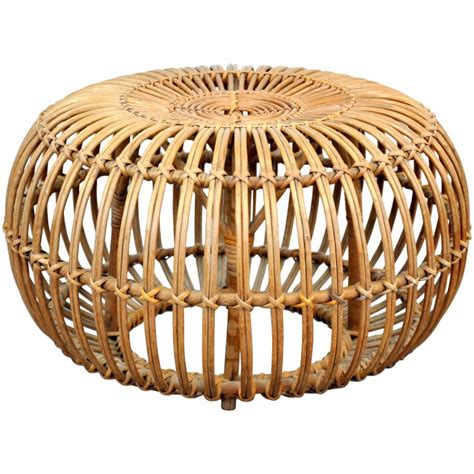 The strong rubber wood and compressed wood frame provides lasting strength and structure. Franco Albini Woven Rattan Ottoman at 1stdibs